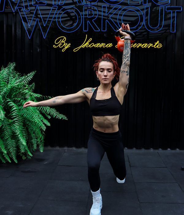 Athlete focused on a stability exercise with a kettlebell.